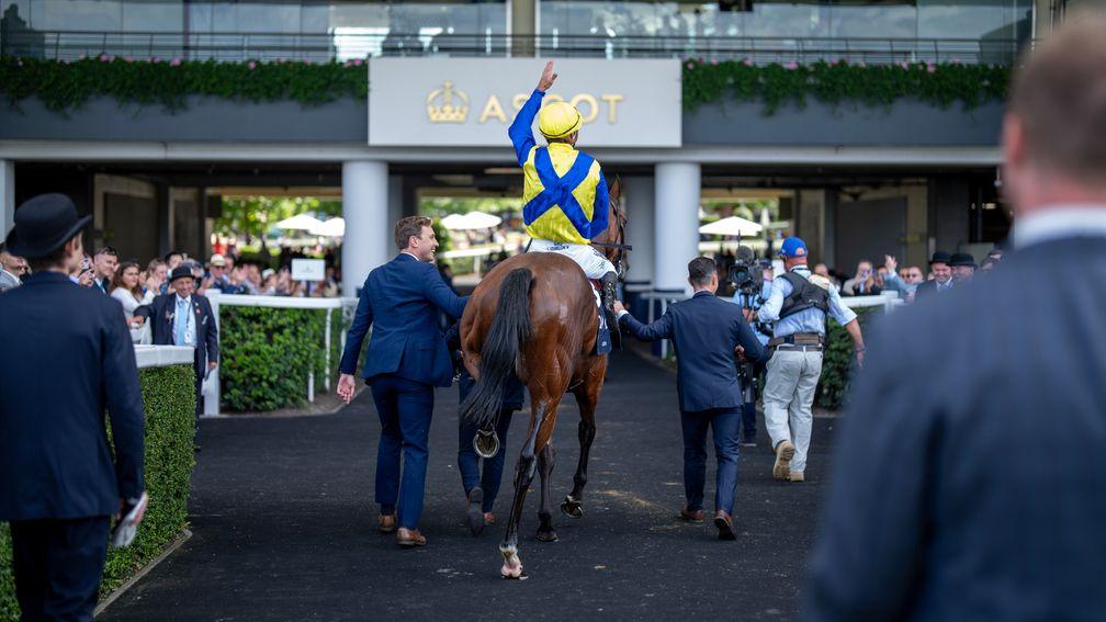 Christophe Soumillon salutes the crowd on his way to the winner's enclosure