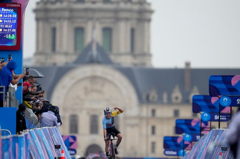 Remco Evenepoel, of Belgium, wins the men's cycling time trial event, at the 2024 Summer Olympics, Saturday, July 27, 2024, in Paris, France. (AP Photo/Ricardo Mazalan)