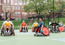 Individuals with disabilities playing wheelchair basketball..