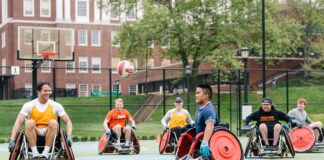 Individuals with disabilities playing wheelchair basketball..