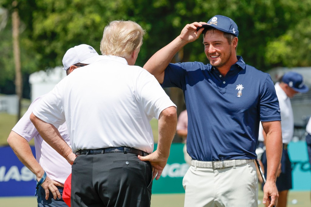 Donald Trump meets with Bryson DeChambeau of the Crushers, right, before the final round of LIV Golf Miami golf tournament at Trump National Doral