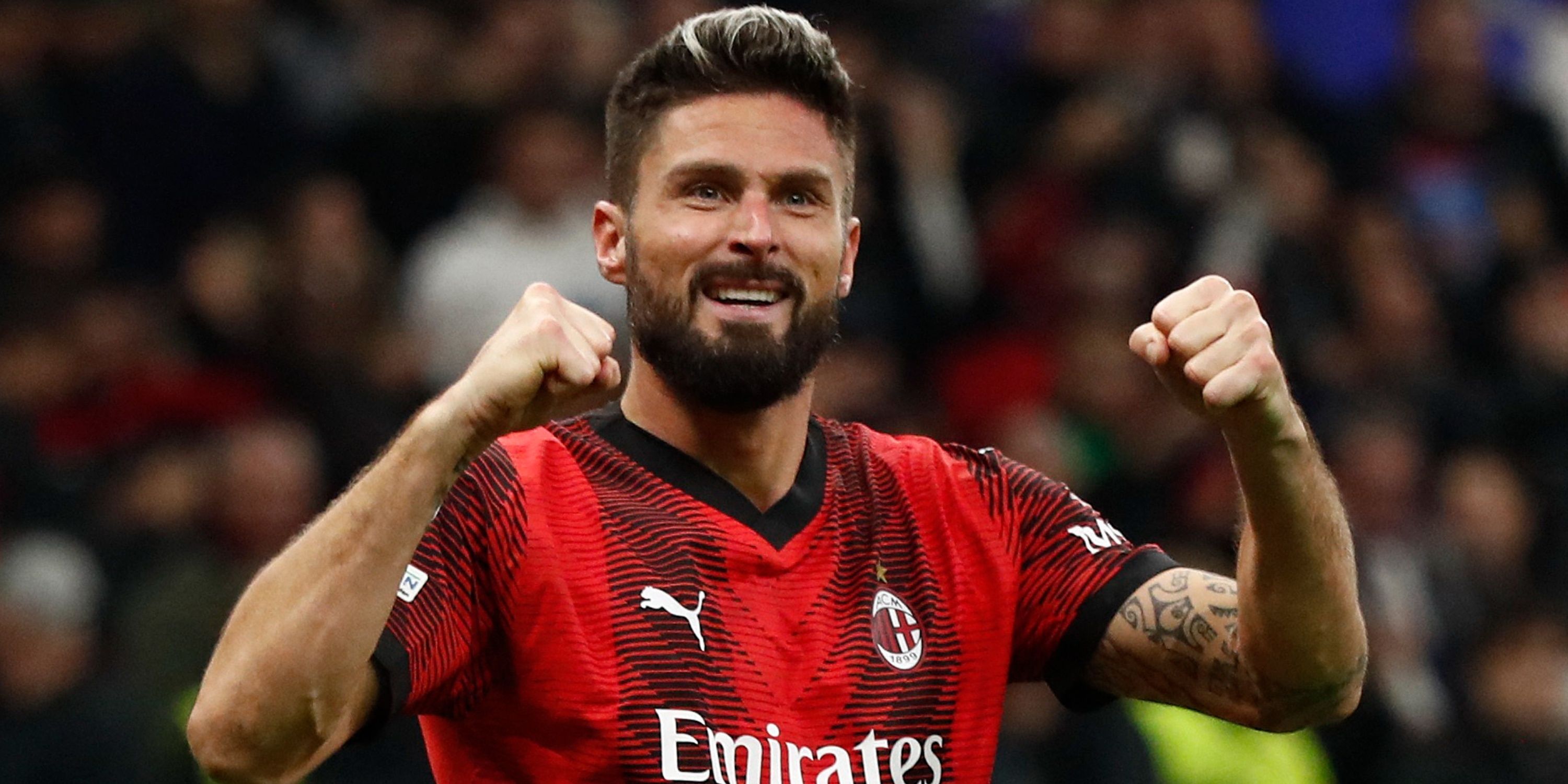 Olivier Giroud celebrates scoring for AC Milan. 