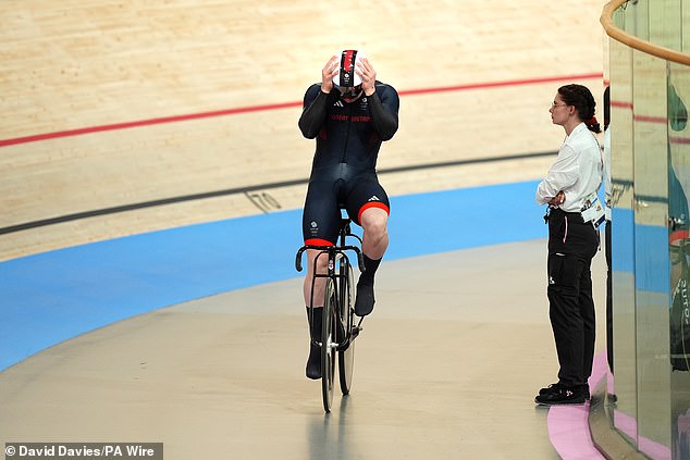 Carlin held his head in his hands after a collision seemed set to lead to disqualification