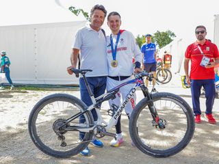 Tom Pidcock with his bike