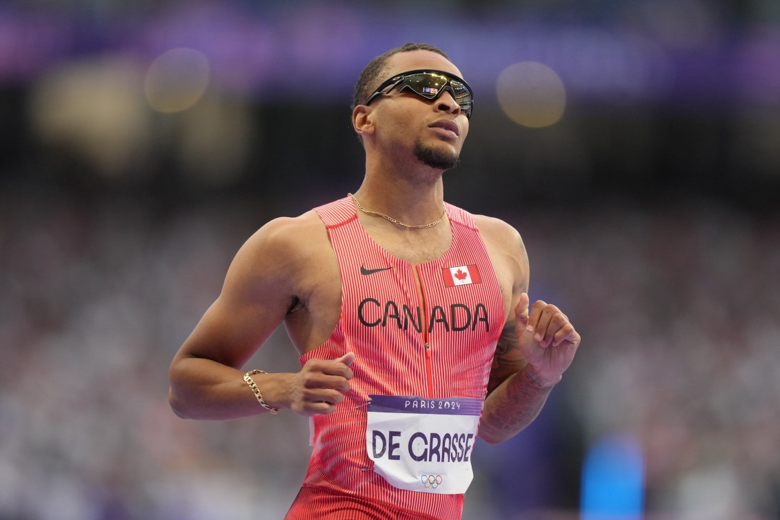 Andre De Grasse reacts after his run in the 100m semifinal on Sunday.