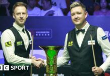 Judd Trump and Kyren Wilson shake hands before the Xi'an Grand Prix final