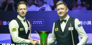 Judd Trump and Kyren Wilson shake hands before the Xi'an Grand Prix final