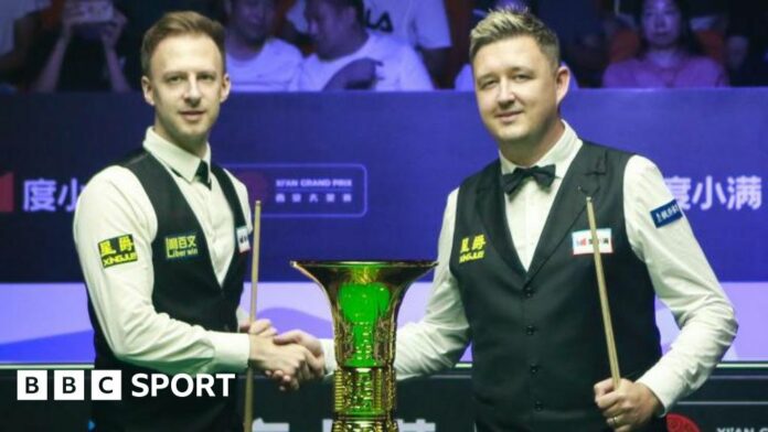 Judd Trump and Kyren Wilson shake hands before the Xi'an Grand Prix final