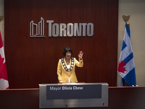 Newly elected Mayor Olivia Chow waves to the crowd at council chambers during her Declaration of Office Ceremony, at Toronto City Hall on Wednesday, July 12, 2023.