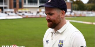 Ben Raine tossing a cricket ball up at Durham's home ground 