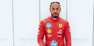 Lewis Hamilton wears the red Ferrari race suit for the first time 