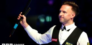 Judd Trump celebrates his quarter-final win at the Masters