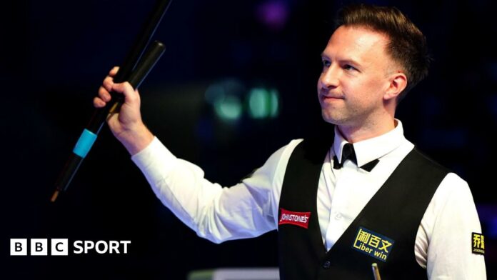 Judd Trump celebrates his quarter-final win at the Masters