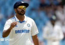 A close up of Shardul Thakur in his sunglasses in the field for India 