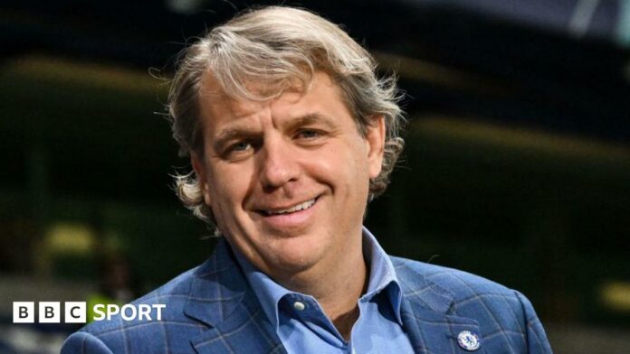 Todd Boehly with a Chelsea badge on his jacket lapel