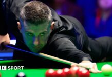 Mark Selby plays a shot in Llandudno