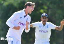 Archie Vaughan celebrates taking a wicket for England U19s