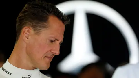 Reuters A 2012 photo of Schumacher in profile, looking down with the Mercedes logo behind him. 