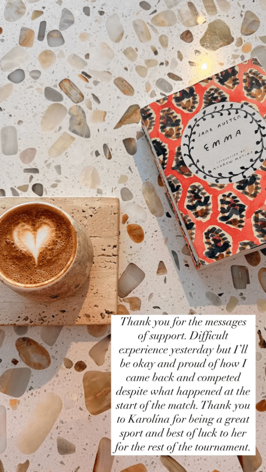 Coffee cup and book on terrazzo countertop.