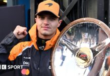 McLaren's Lando Norris holds the winner's trophy for the Australian Grand Prix