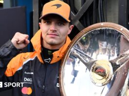 McLaren's Lando Norris holds the winner's trophy for the Australian Grand Prix