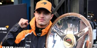 McLaren's Lando Norris holds the winner's trophy for the Australian Grand Prix