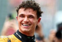 McLaren's Lando Norris smiles as he celebrates qualifying on pole for the Australian Grand Prix