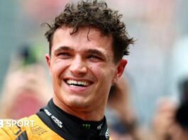 McLaren's Lando Norris smiles as he celebrates qualifying on pole for the Australian Grand Prix