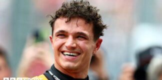 McLaren's Lando Norris smiles as he celebrates qualifying on pole for the Australian Grand Prix