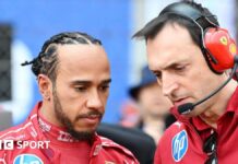 Lewis Hamilton stands next to his race engineer Riccardo Adami 