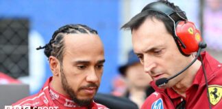 Lewis Hamilton stands next to his race engineer Riccardo Adami 