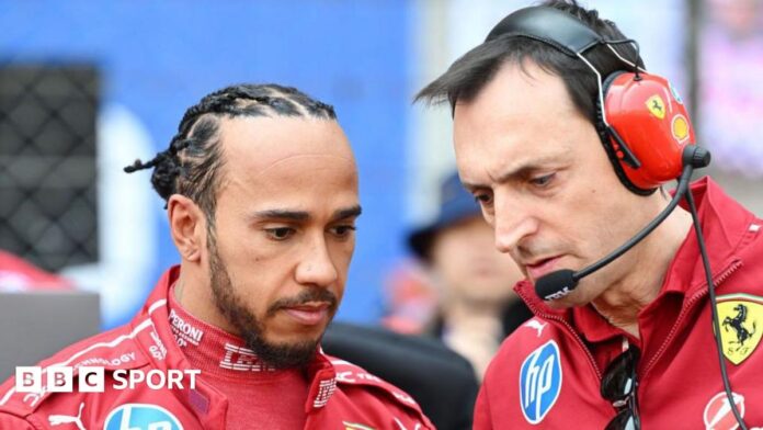 Lewis Hamilton stands next to his race engineer Riccardo Adami 