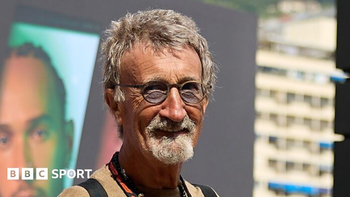 Eddie Jordan smiles while posing for a photograph