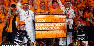 McLaren drivers Lando Norris and Oscar Piastri celebrate winning the constructors' championship with their team.