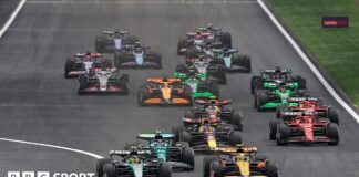 Lewis Hamilton leads Lando Norris into the first corner during the 2024 Chinese Grand Prix sprint race