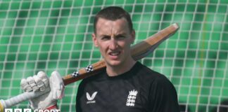 England batter Harry Brook rests his bat on his shoulder in training