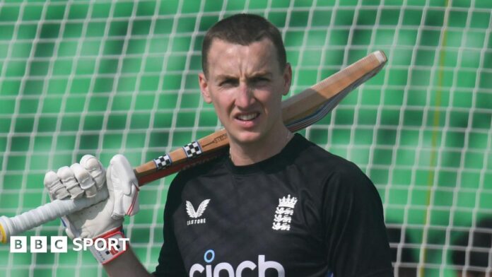 England batter Harry Brook rests his bat on his shoulder in training