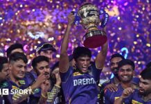 Kolkata Knight Riders players celebrate with the IPL trophy after winning the 2024 final