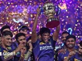 Kolkata Knight Riders players celebrate with the IPL trophy after winning the 2024 final