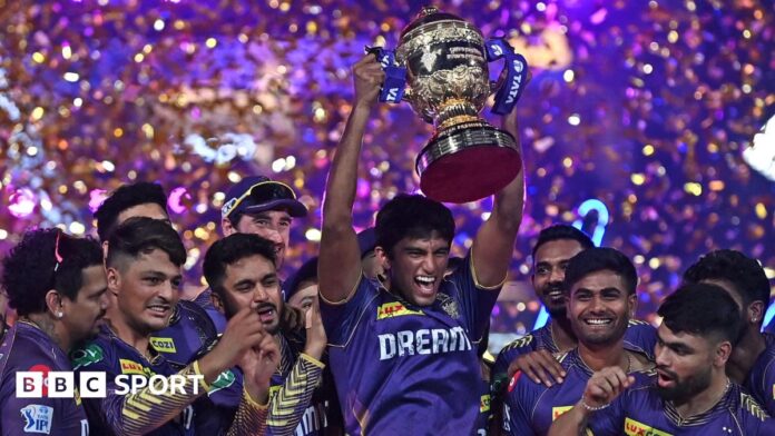 Kolkata Knight Riders players celebrate with the IPL trophy after winning the 2024 final