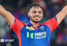 Ashutosh Sharma raises his hands in celebration after hitting the winning runs for Delhi Capitals against Lucknow Super Giants