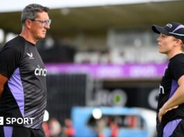 Former England coach Jon Lewis (left) in discussion with captain Heather Knight