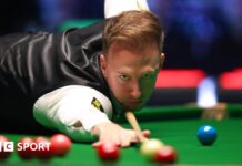 Judd Trump plays a shot during the Players Championship semi-final against John Higgins