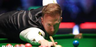 Judd Trump plays a shot during the Players Championship semi-final against John Higgins