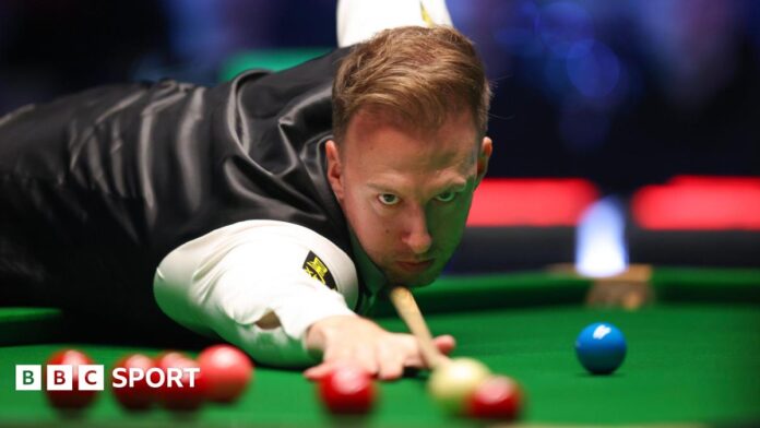 Judd Trump plays a shot during the Players Championship semi-final against John Higgins