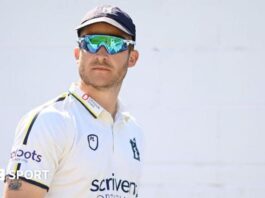 Sam Hain raises his bat to the crowd after scoring a half-century in the T20 Blast for Birmingham Bears