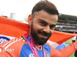 Virat Kohli celebrates with the flag of India after his side's T20 World Cup win in 2024