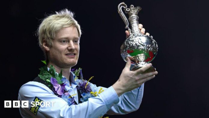 Neil Robertson lifts the World Grand Prix trophy after beating Stuart Bingham in the 2025 final